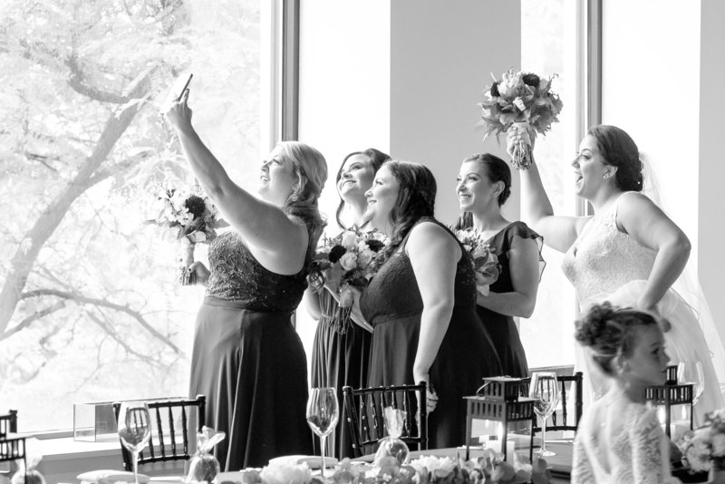 Bridesmaids and bride capture a selfie