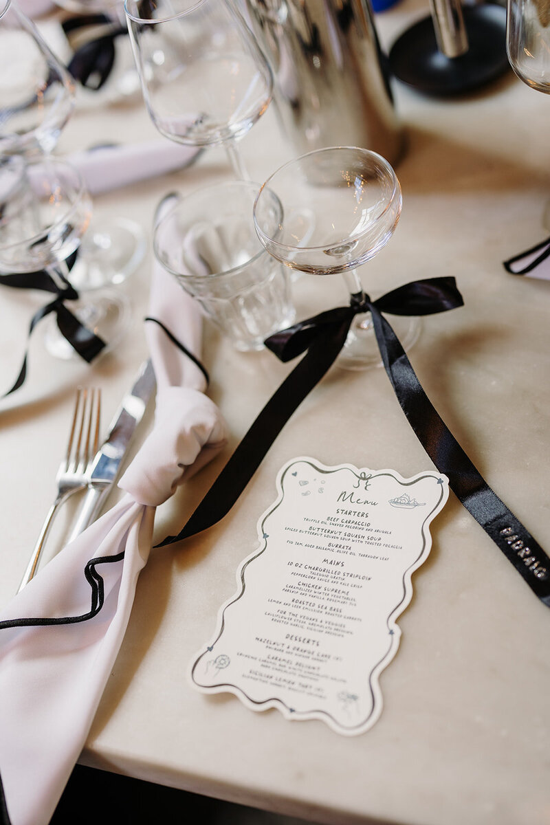 Chic black and white wedding menu and table decor at Roberta's in Dublin, Ireland