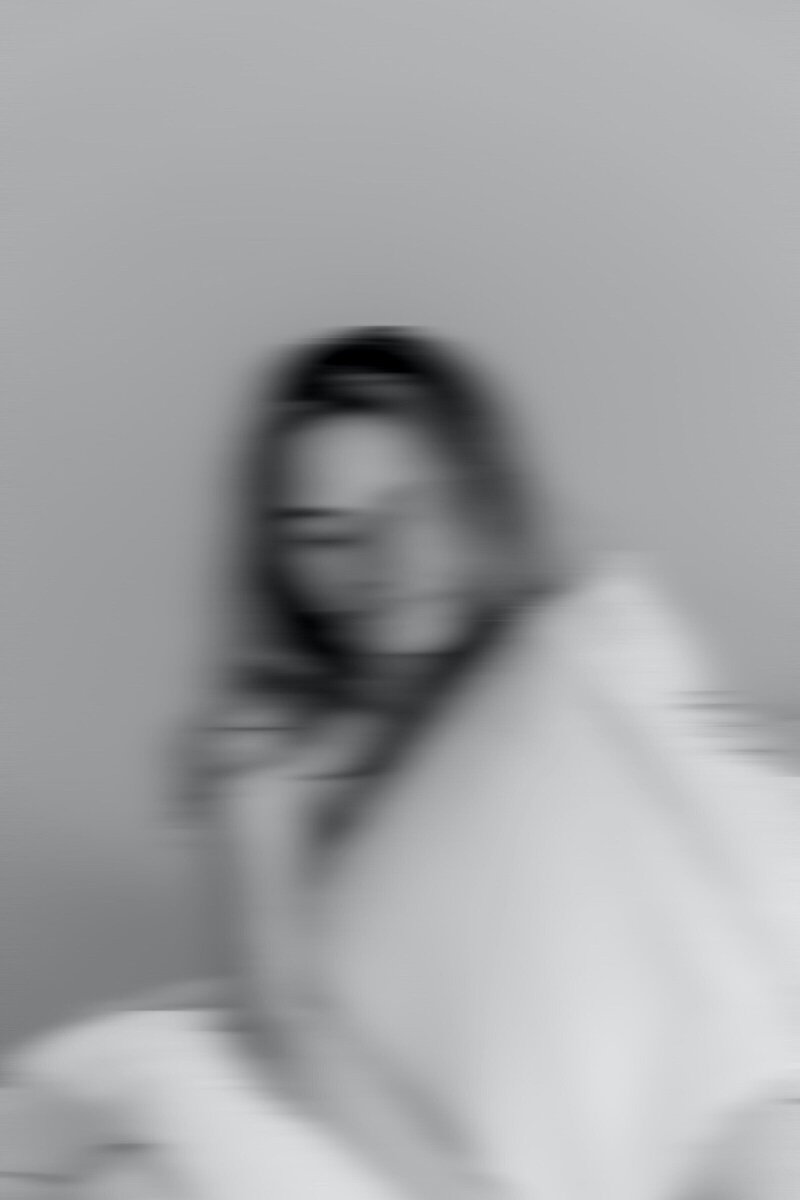 Blurred abstract black and white photo of a woman