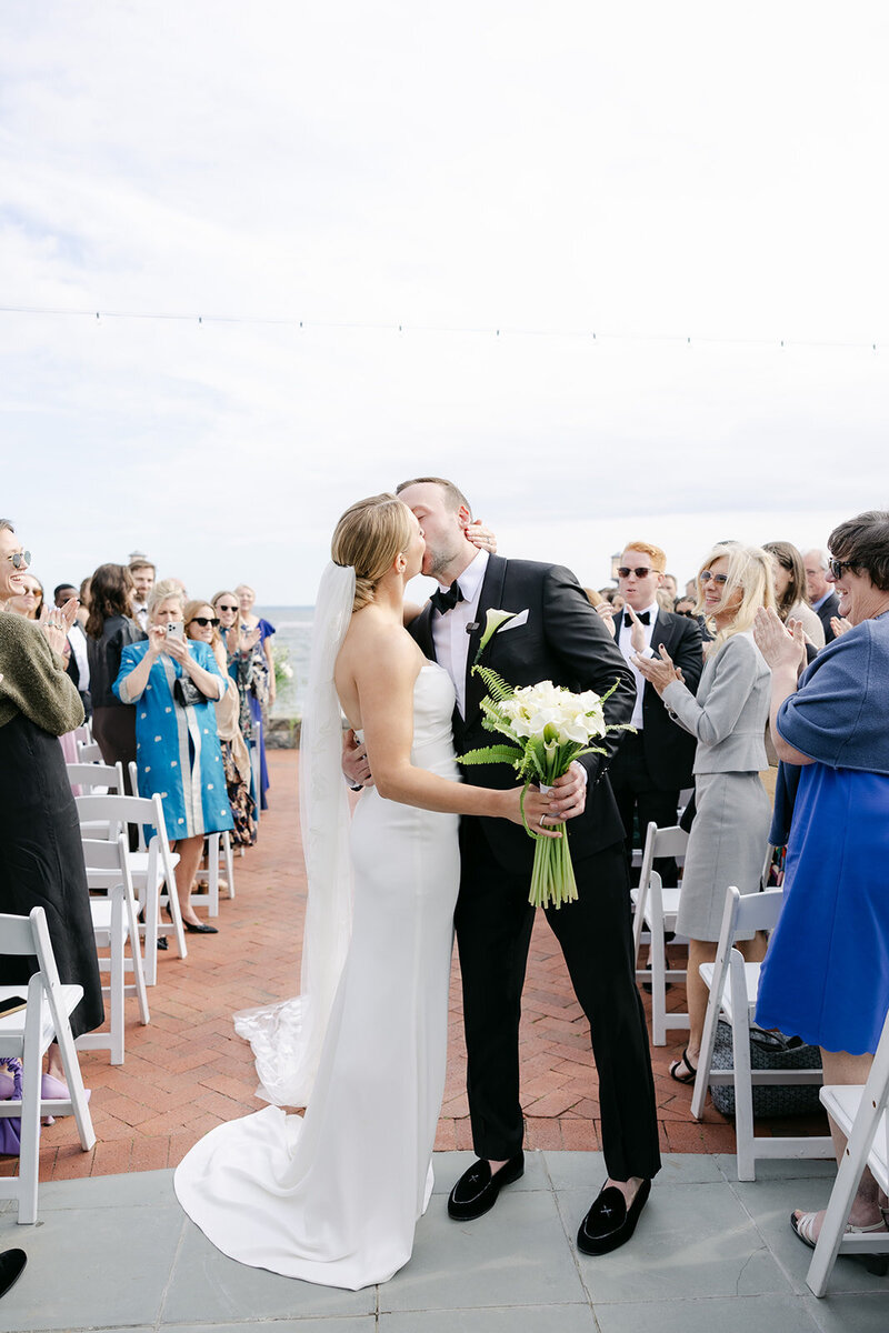 bride-groom-kiss-coastal-wedding