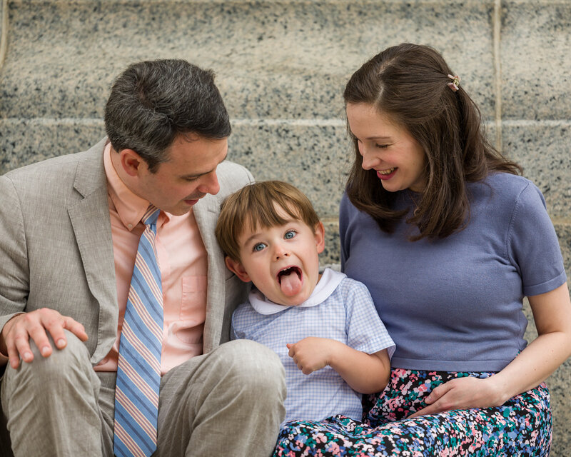 A mischievous boy with his tongue out, enjoying the vibrant spring scenery at Valley Forge