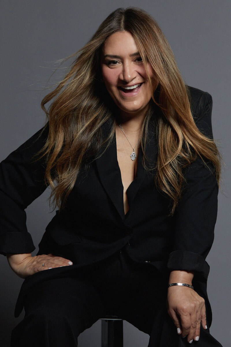 Hair stylist coach reviewing a business plan with the help of a professional coach.