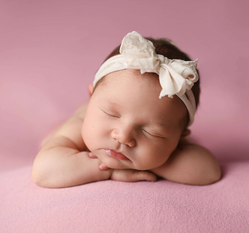 cute sleeping baby close-up on pink blanket
