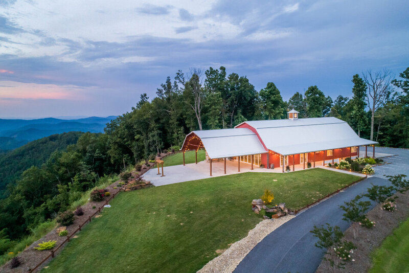 The barn with beautiful views of the Blue Ridge Mountains behind it.