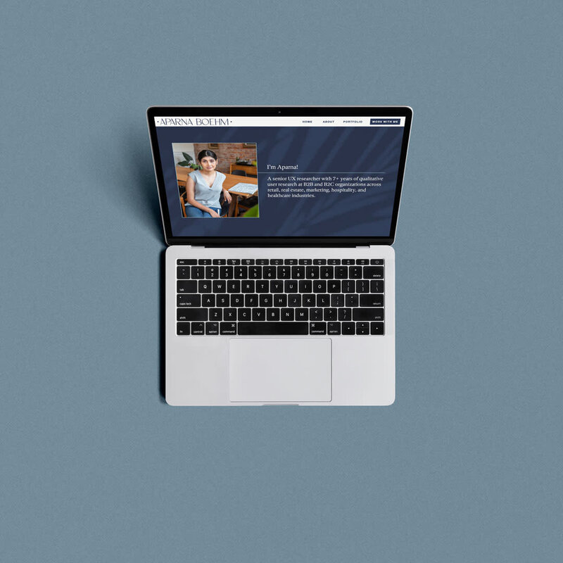 Laptop with Aparna's website.
