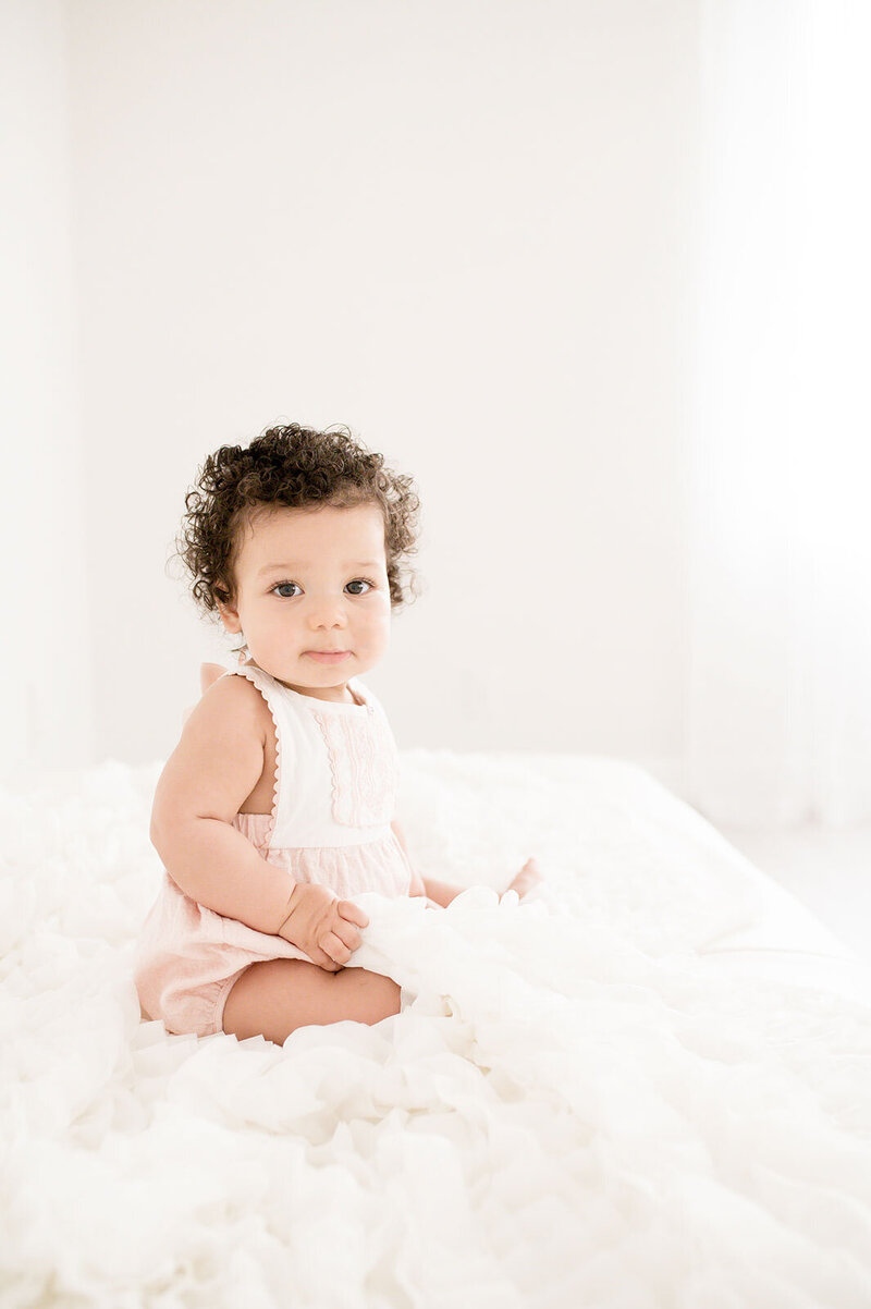 Baby girl sitting in studio | Fleur Photography