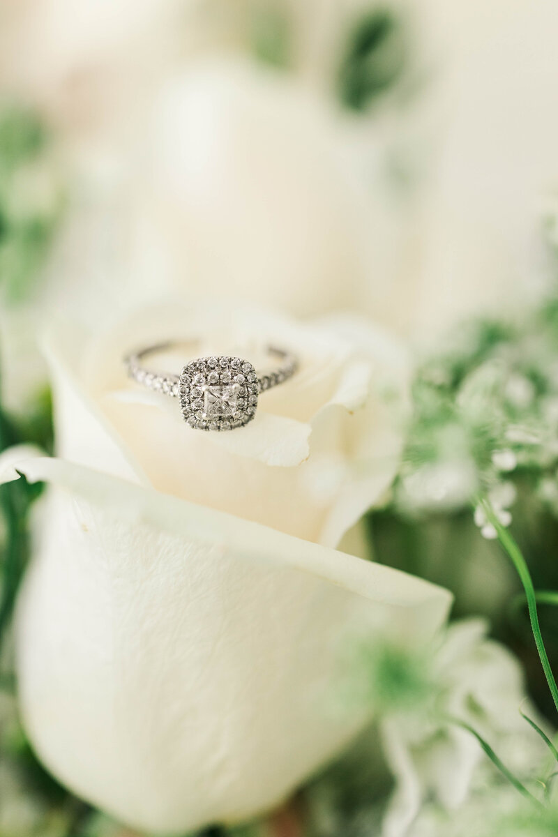 ring with white roses during wedding photo session in upstate ny