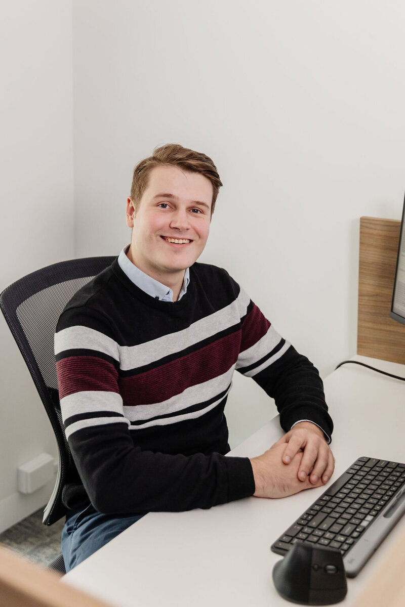 Michael smiles and poses at Headstrong Psychology in Malvern East