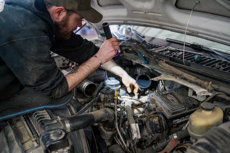 Certified mechanics checking engine