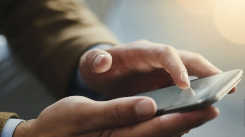 Hands using phone