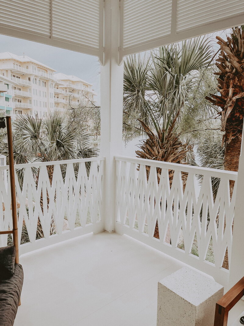 white patio with decorative railing