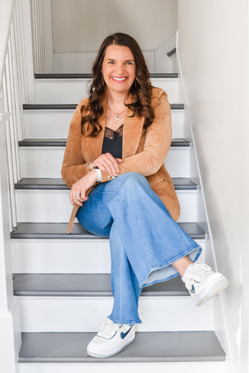 Christina sitting on stairs