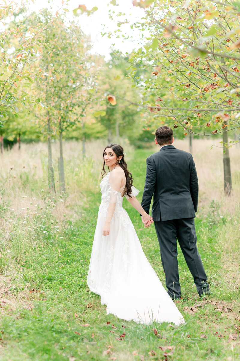 Pittsburgh wedding photography couple walking in orchard