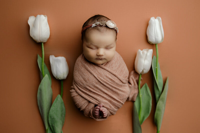 baby with flowers