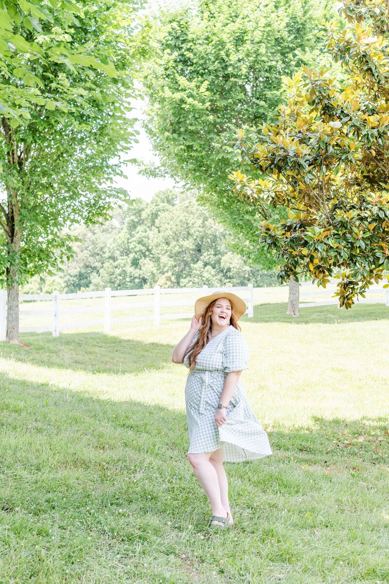 Elyse Stokes, Owner of E Stokes Creations, Smiling in a Field