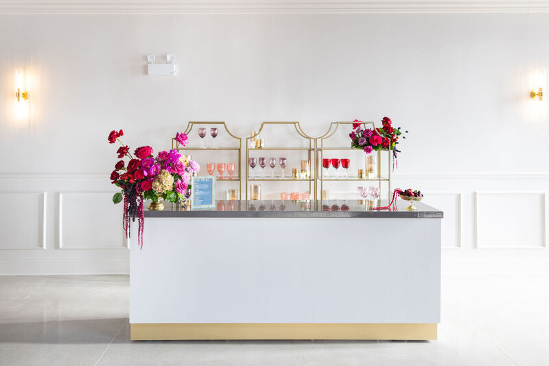 added floral and design elements to venue in-house single or double bar, natural light from Happy Hour