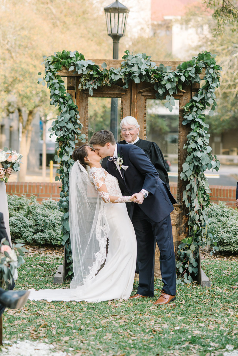 couple kissing after ceremony at wedding in savannah georgia photography