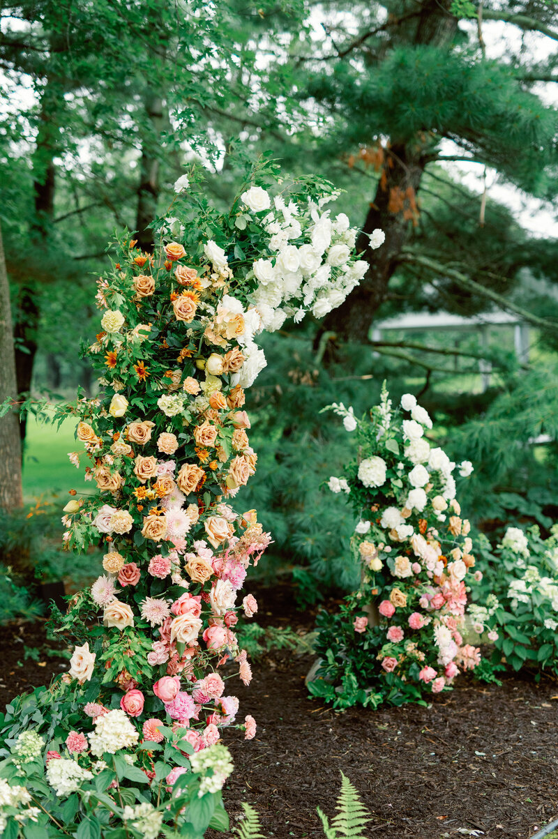reception details including table numbers, flowers, and bright napkins at minneapolis wedding