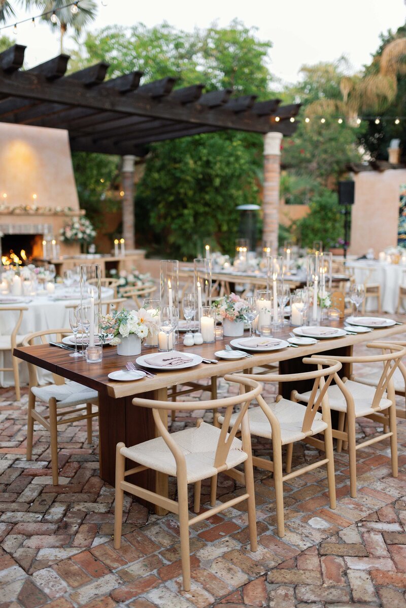 wedding guests enjoy outdoor patio in the desert for cocktail hour
