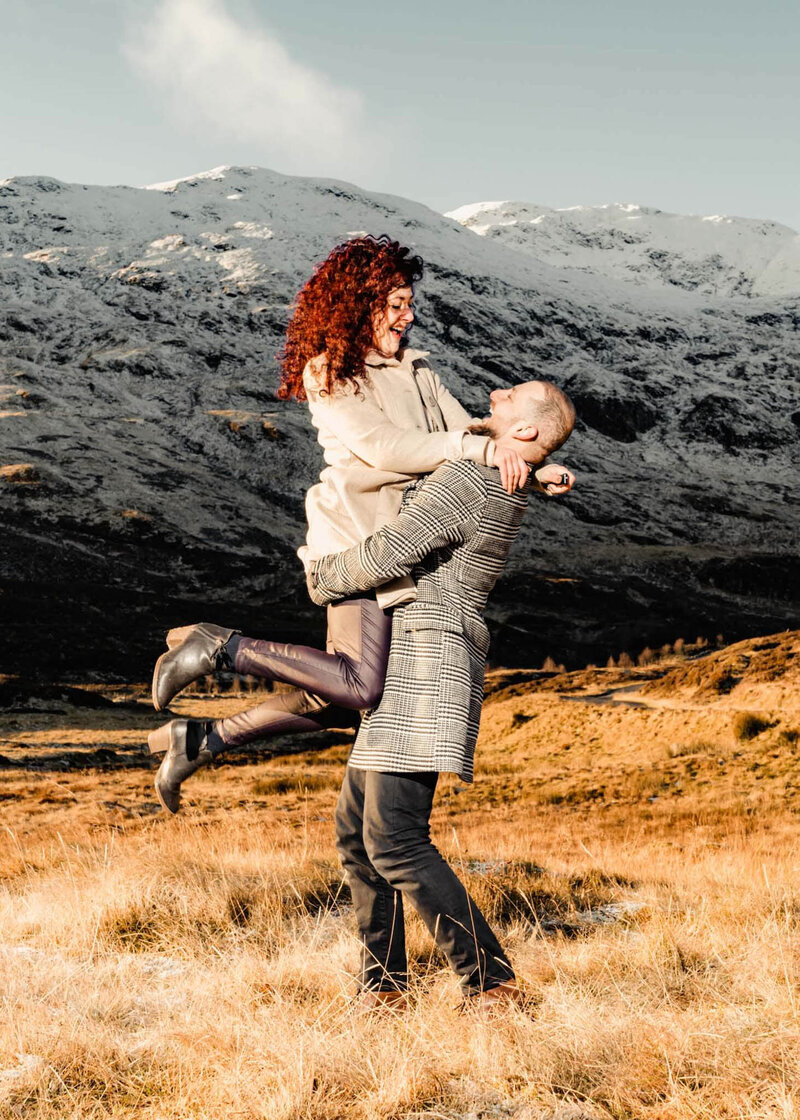 Nick and Luiza Calini, editorial wedding photographers, pictured together at the beach in an intimate portrait