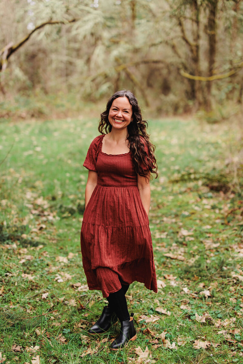 Woman smiling wearing a red dress