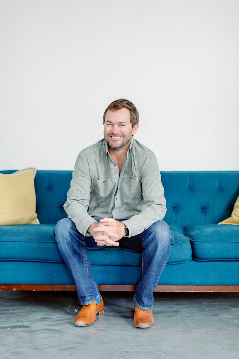 A smiling headshot of Jon, Alison amick photography's studio manager
