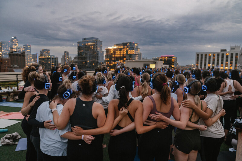 Group of women circling up after an event