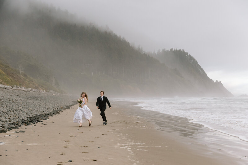 Bride and groom sitting on a bench in the Akron Art Museum with a gallery of paintings behind them. 