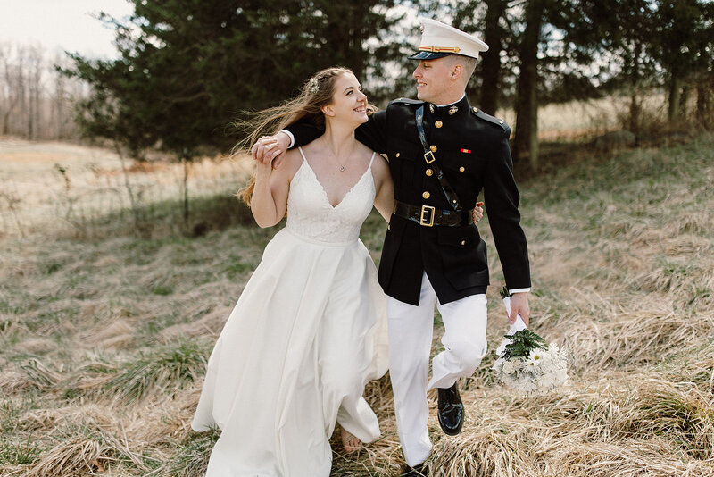 bride walking with groom in uniform