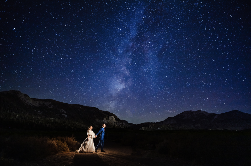Wedding couple under the stars and Milky Way in Mammoth California
