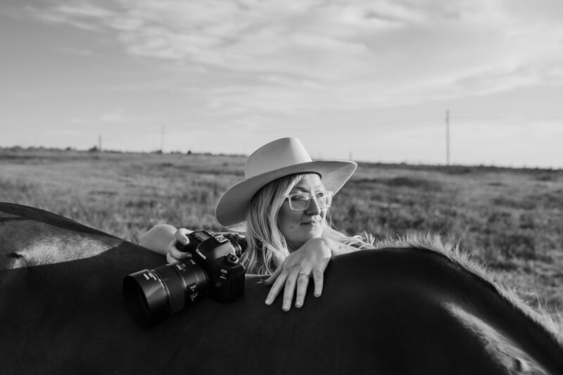 photographer on horse in black and white