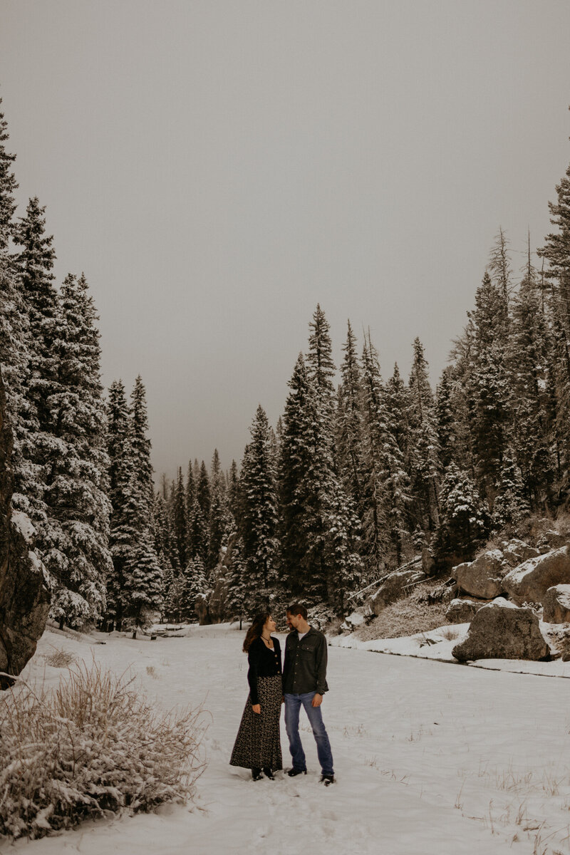 engaged couple sitting on a bike trail in Albuquerque