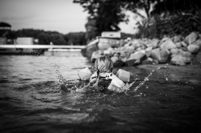 child-splashing-lake