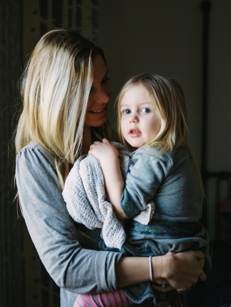 mom holds daughter during a niwot colorado photosession