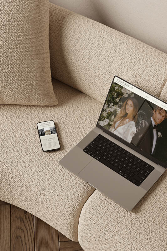 Laptop and smartphone displaying a luxury wedding photographer’s Showit website template—styled on a neutral sofa to showcase the responsive design from The Closers Society's Website in a Day service.