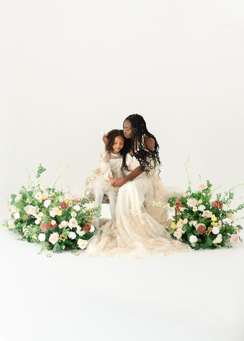 In-studio Maternity Session with floor floral arrangments for mother's day minis photoshoot
