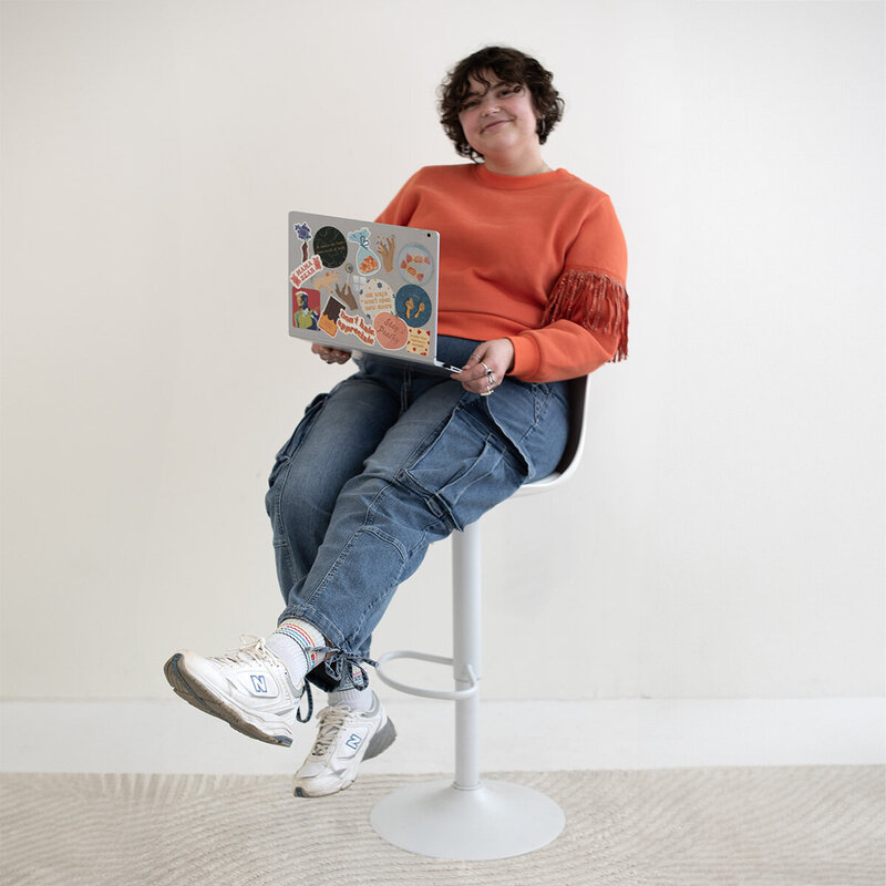 woman brand designer with orange groovy aesthetic