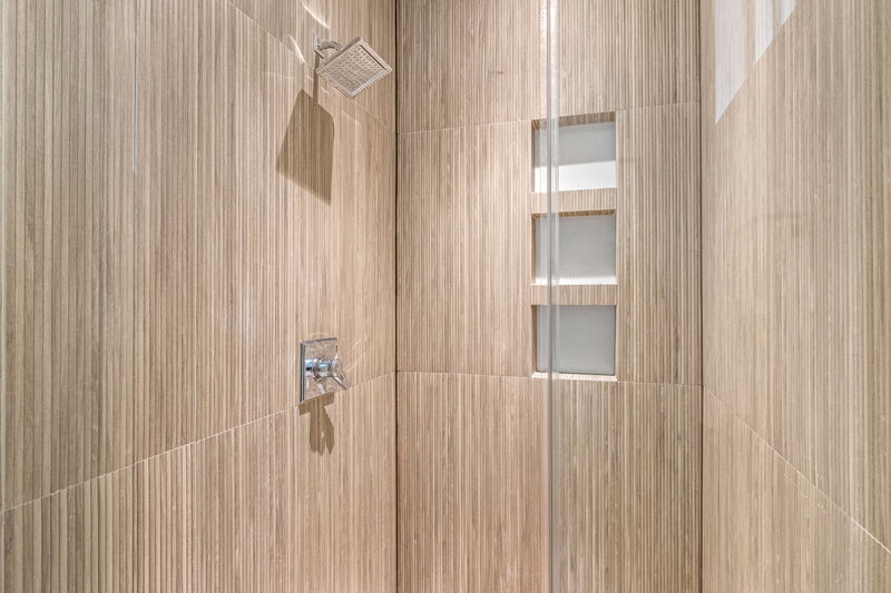 modern walk in bathroom with wood  tile
