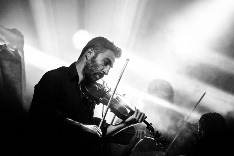 Canva - Greyscale Photography of Man Playing Violin