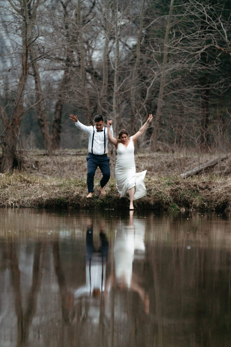 Bride and Groom jump into the Merced River while eloping in Yosemite