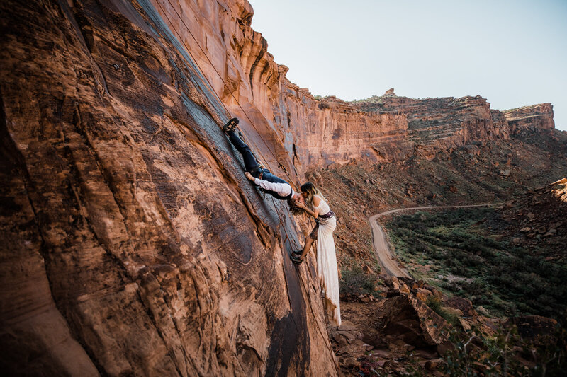 in an arizona slot canyon the couple celebrates their elopement, kissing and spinning in circles.
