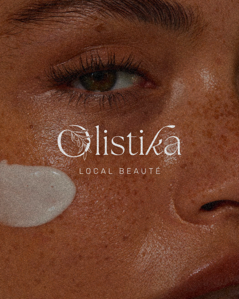 Logo olistika présenter sur un fond d'un visage d'une femme