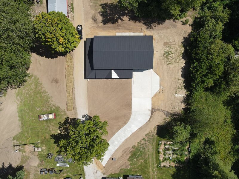 Aerial view of a long, curving new concrete driveway in Elkhart, IN