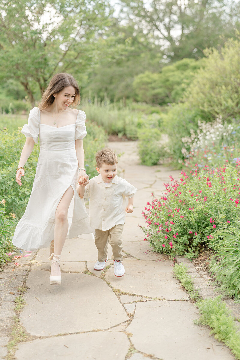 mom and son running at a garden in Vienna, VA