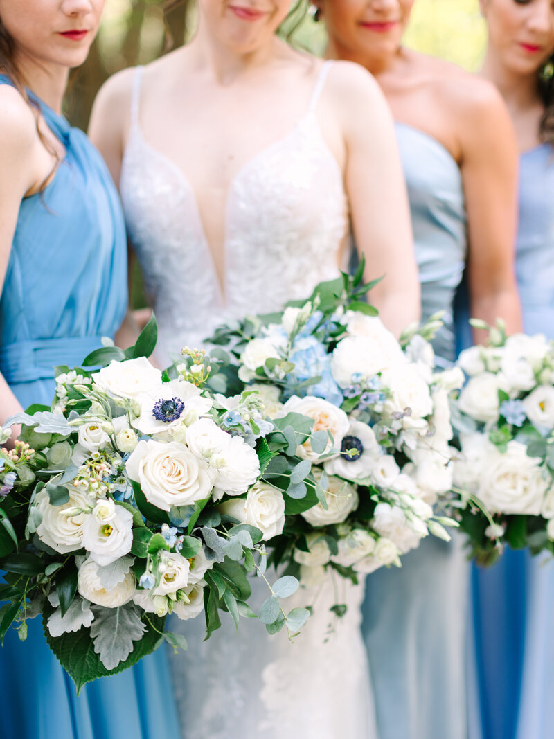 Bride with bridesmaids and floral bouquets