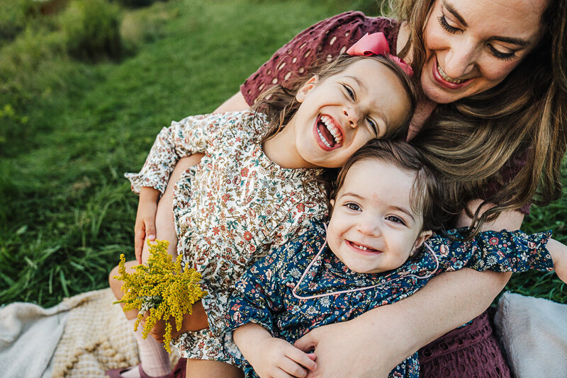 boston family laughs together in kitchen