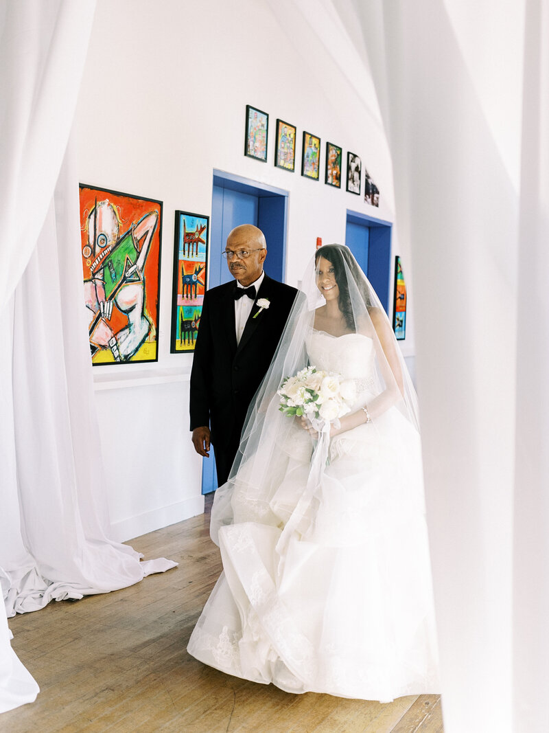 Father of bride walking daughter down the aisle