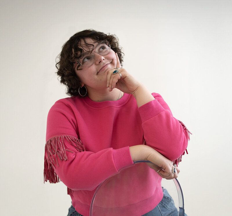 woman brand designer in pink sweater pretty aesthetic