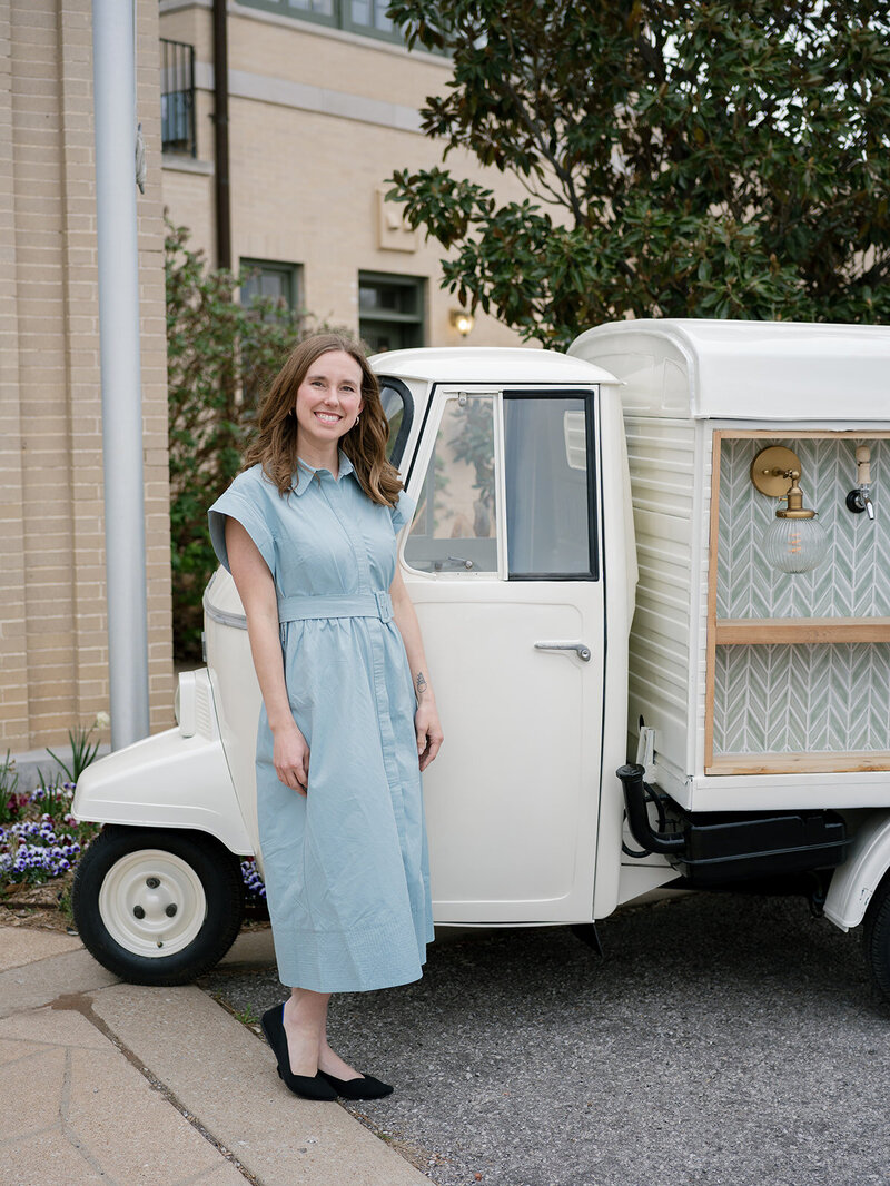 Owner of Bar on 3 standing next to vintage Piaggio Ape bar
