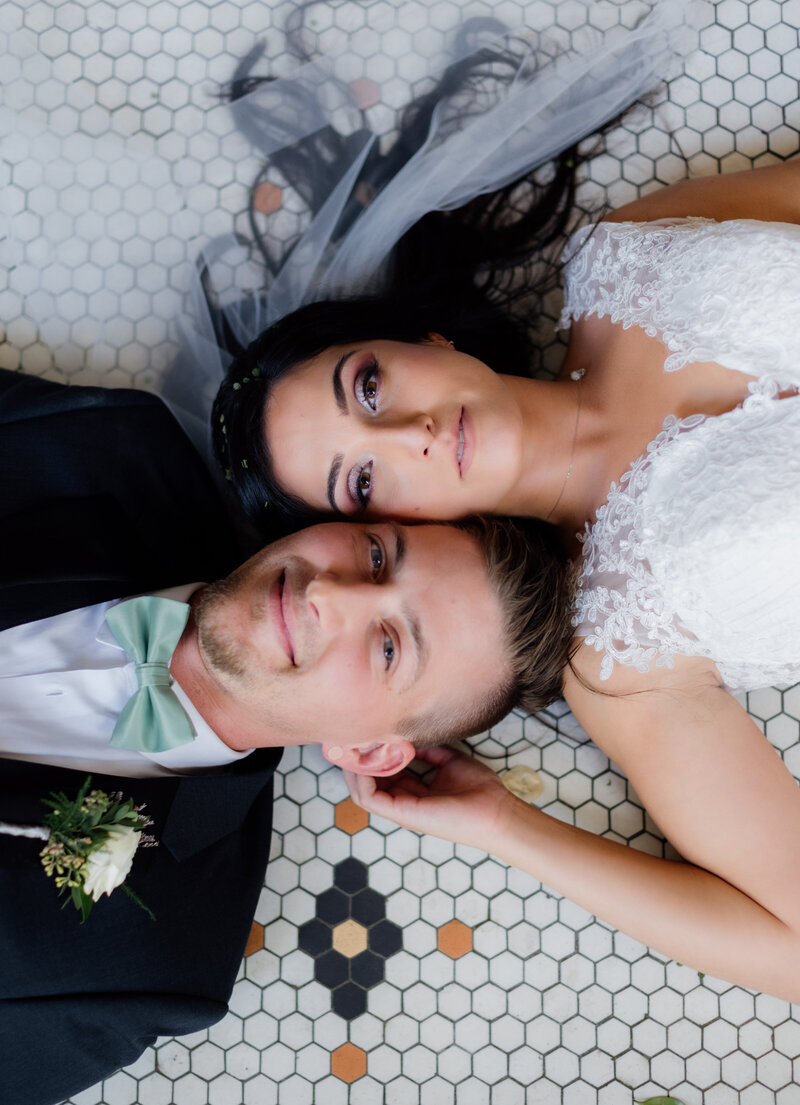 bride and groom looking up